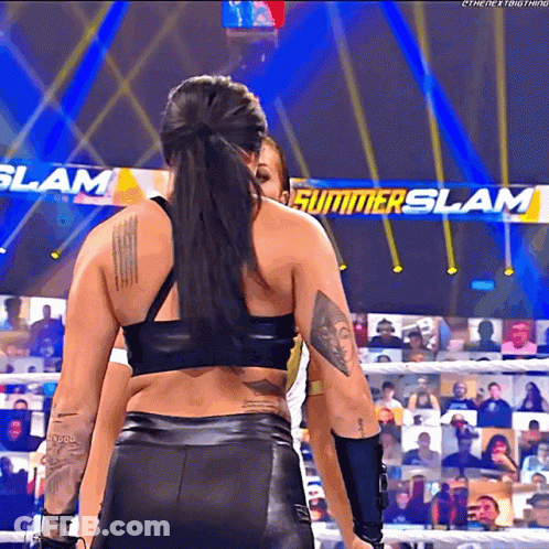 Female Wrestler In Front Of Summerslam Sign GIF