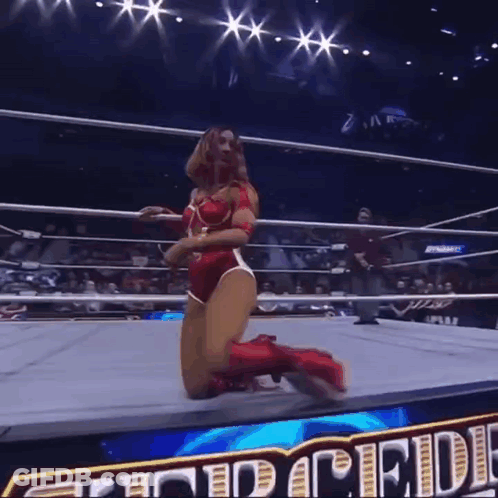 Female Wrestler Kneeling With Pride Text Behind GIF