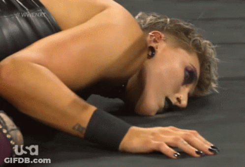 Female Wrestler Lying Head Down GIF