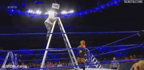 Female Wrestler Sitting On Ladder In Ring GIF