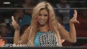 Female Wrestler Standing In Front Of NXT Screen GIF
