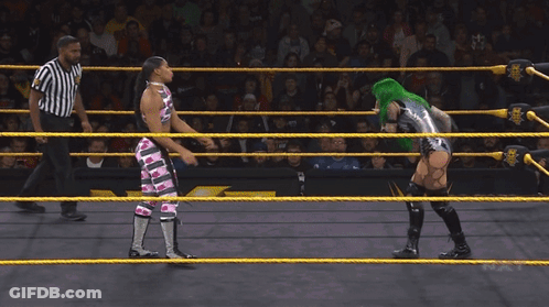 Female Wrestler With Green Hair Blowing Bubble Gum GIF