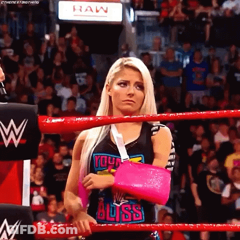 Female Wrestler With Pink Cast In Ring GIF