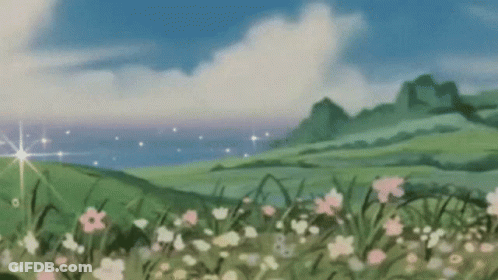 Field With Flowers And Blue Sky GIF