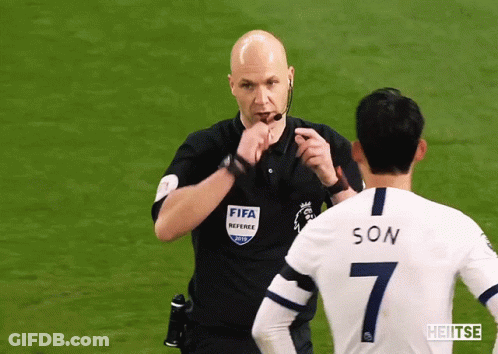 FIFA Referee Talking To Soccer Player Number 7 GIF