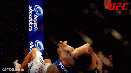 Fighter Being Pinched By Referee GIF