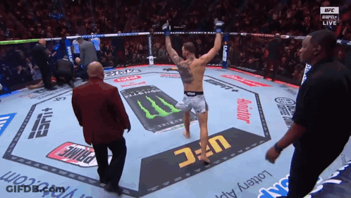 Fighter In UFC Ring With Monster Energy Drink GIF