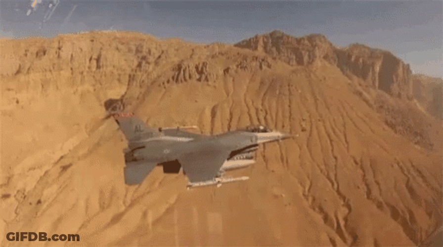 Fighter Jet Flying Over Deserted Area GIF