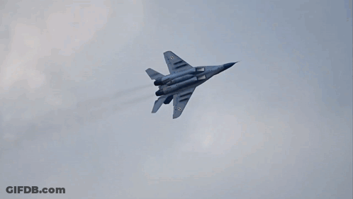 Fighter Jet Flying Through Clouds GIF