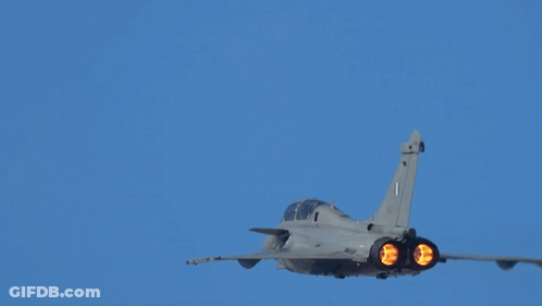 Fighter Jet With Number 1 On Tail Flying Through Blue Sky GIF