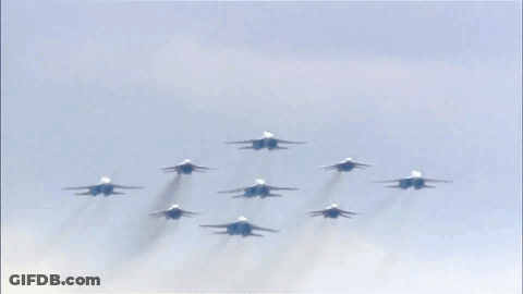Fighter Jets Flying In Formation Against Blue Sky GIF