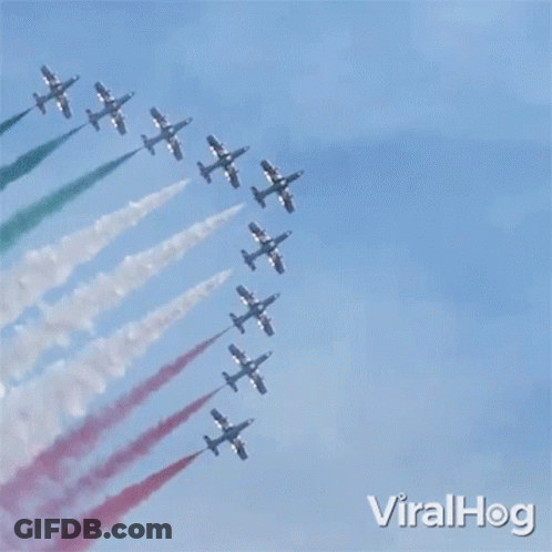 Fighter Jets Flying In Formation With Red White And Green Smoke GIF