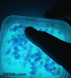 Finger Pointing At Glow In The Dark Stars GIF