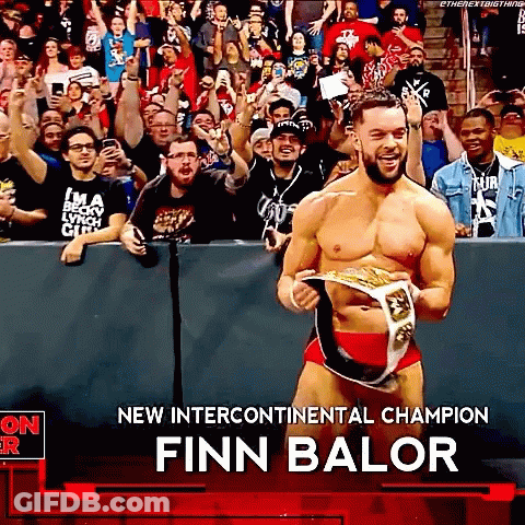 Finn Balor Is The New Intercontinental Champion And Is Holding His Belt In Front Of A Crowd . GIF