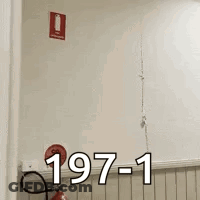 Fire Extinguisher On Shelf With 197-1 Sign GIF