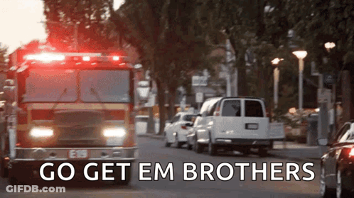 Fire Truck Driving Down Street Saying Go Get Em Brothers GIF