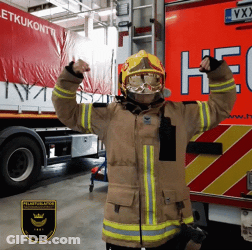 Firefighter Man Flexing Muscles GIF
