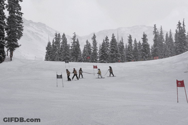 Firefighter Skiing While Holding On Fire Hose GIF