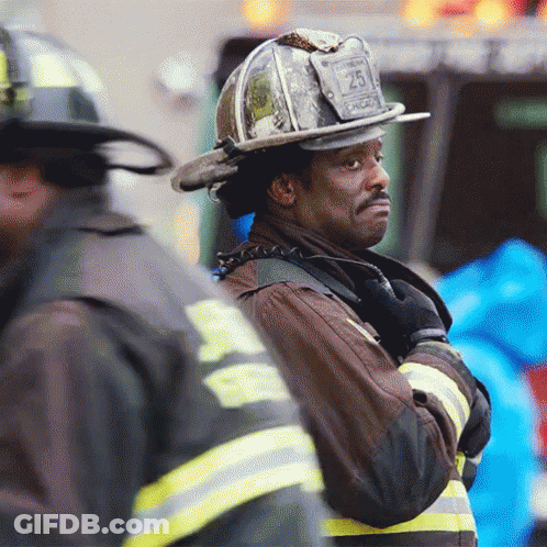 Firefighter Wearing Helmet With Number 25 GIF