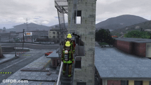 Firefighters Standing On Building Next To Fire Escape GIF