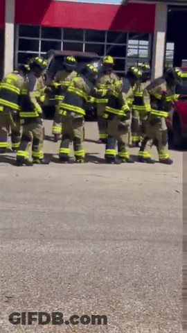 Firefighters Standing Outside Fire Station GIF