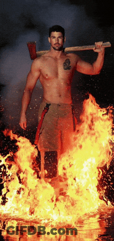 Fireman Holding Axe In Front Of Flames GIF