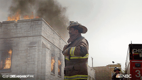 Fireman In Front Of Burning Building #ChicagoFire GIF