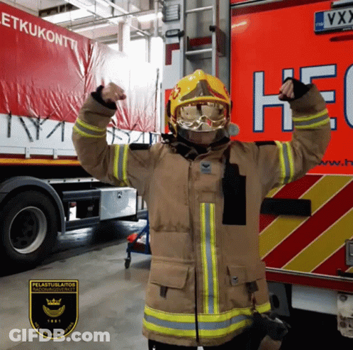 Fireman In Uniform In Front Of HEC Truck GIF