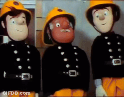Fireman In Yellow Helmet 510 Spraying Water GIF