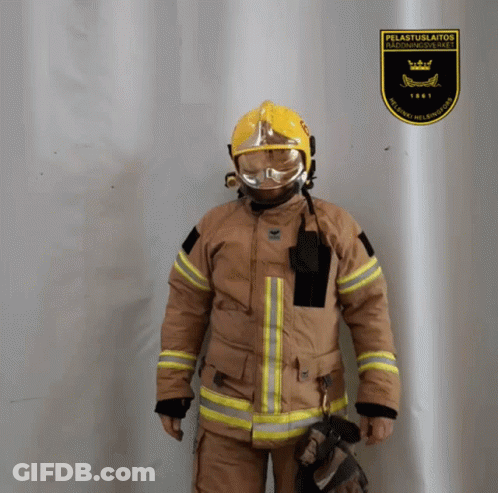 Fireman Standing In Front Of Pelastuslaitos Sign GIF