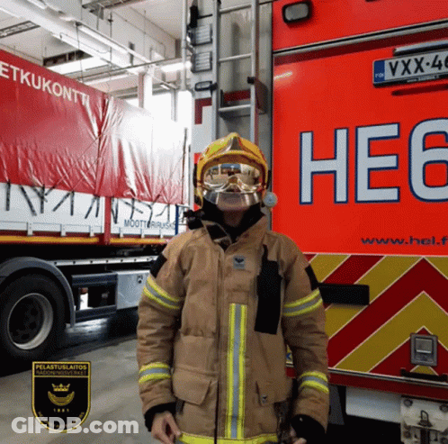 Fireman Standing In Front Of Truck Saying He6 GIF