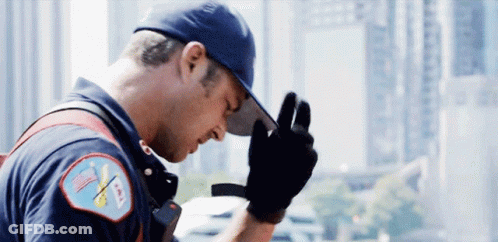 Fireman With Hat And Gloves And AA Patch GIF