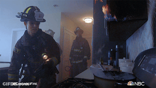 Fireman With Number 81 On Helmet In Kitchen GIF