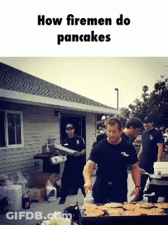 Firemen Making Pancakes Around Table GIF
