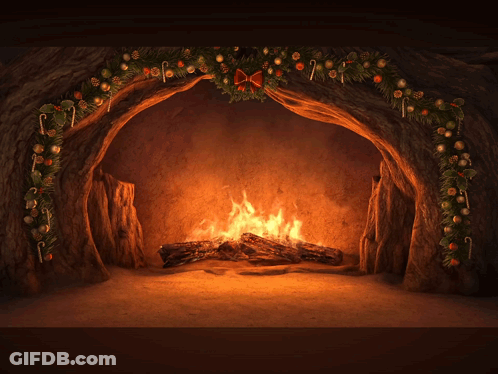 Fireplace Decorated For Christmas With Green Gift Box GIF