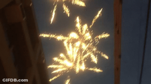 Firework Display In Night Sky GIF
