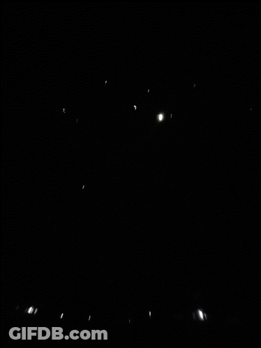 Firework Display Over House At Night GIF