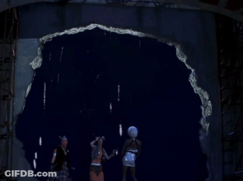 Fireworks Are Displayed Over A Sign That Says ' E.k. ' On It GIF