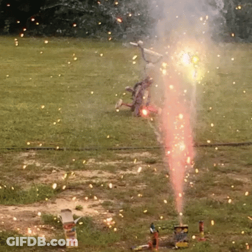 Fireworks Display In Field With Box In Foreground GIF