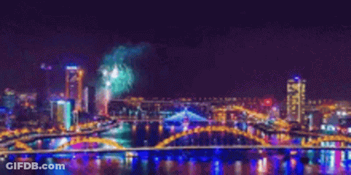 Fireworks Over City Bridge GIF