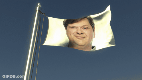 Flag With Man's Face Flying GIF