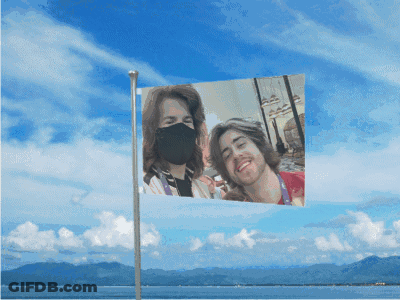 Flag With Two People Wearing Face Masks GIF