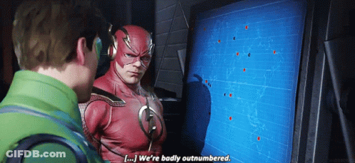 Flash Costume Man Talking To Man In Green Jacket GIF