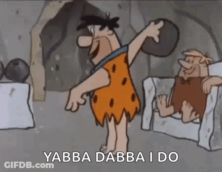 Flintstone Holding Rock Next To Chair GIF