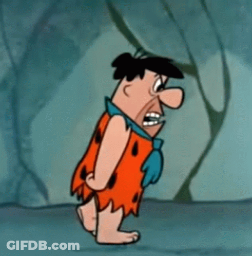 Flintstone Is A Cartoon Character From The Flintstones And Is Walking In A Cave . GIF