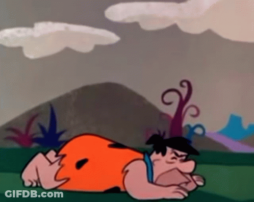Flintstone Laying On Ground GIF