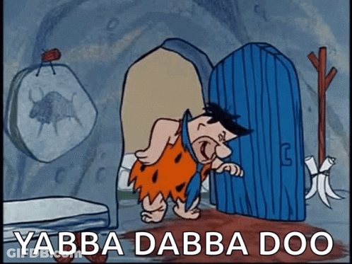 Flintstone Saying Yabba Dabba Doo In Front Of Blue Door GIF