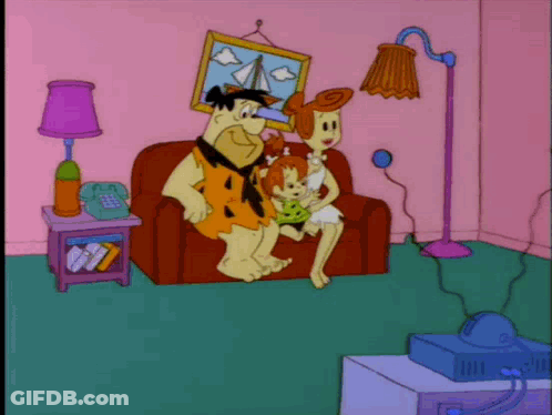 Flintstones Watching Television On Couch GIF