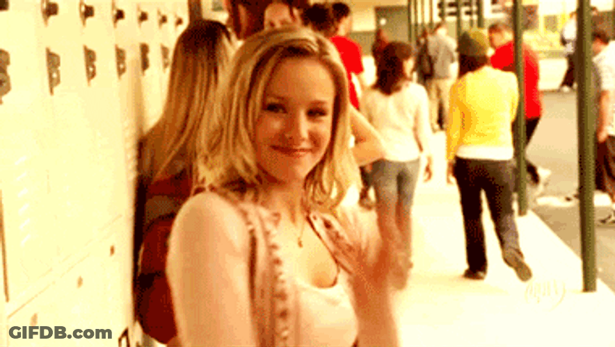 Flirty Woman Waving And Smiling GIF