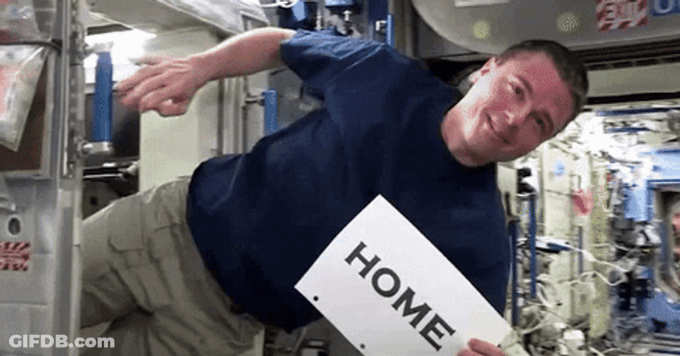 Floating Astronaut Holding Sign Home GIF